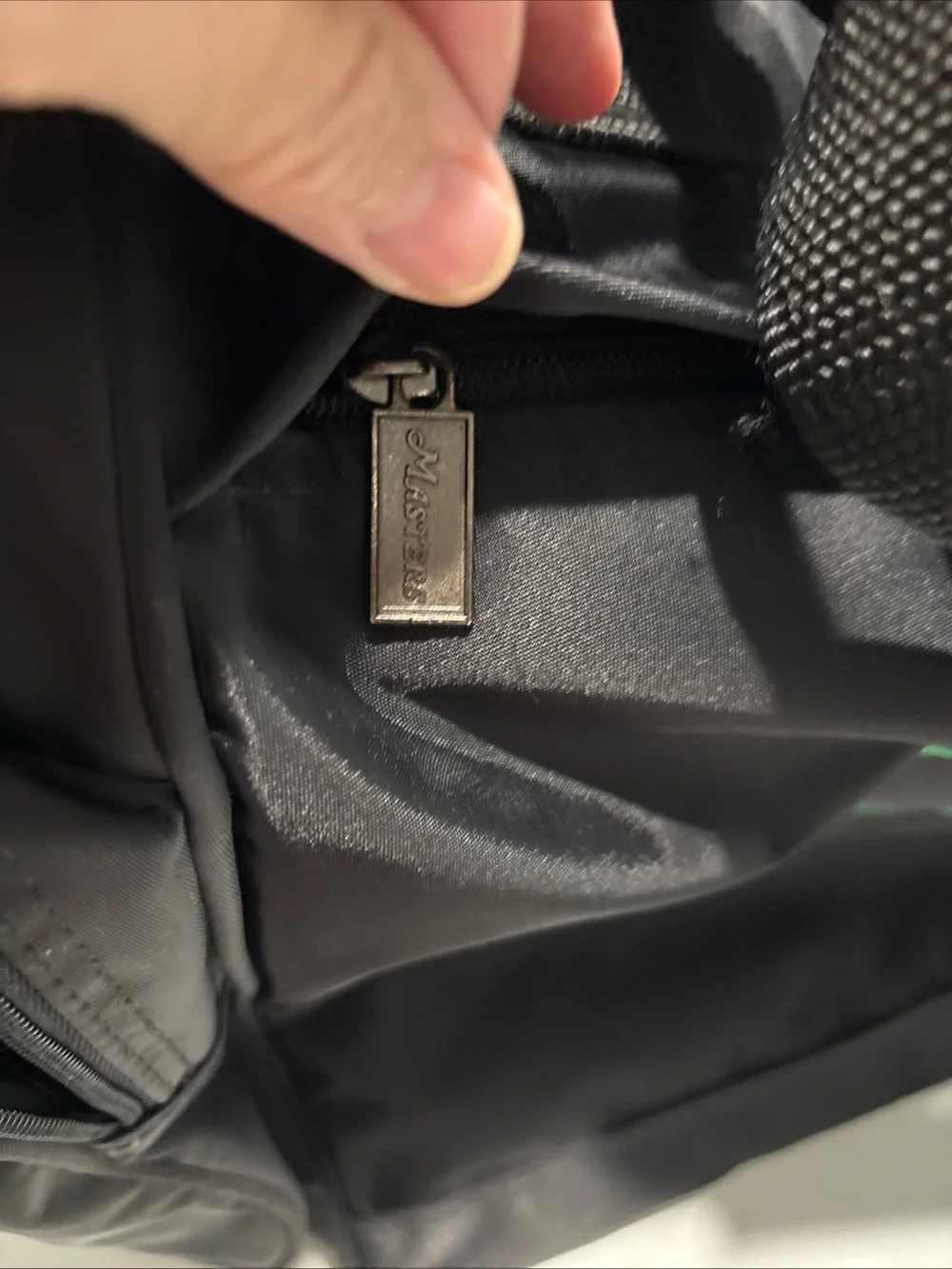The Master’s officially licensed Black Tote Bag with Green Golf Flag Logo